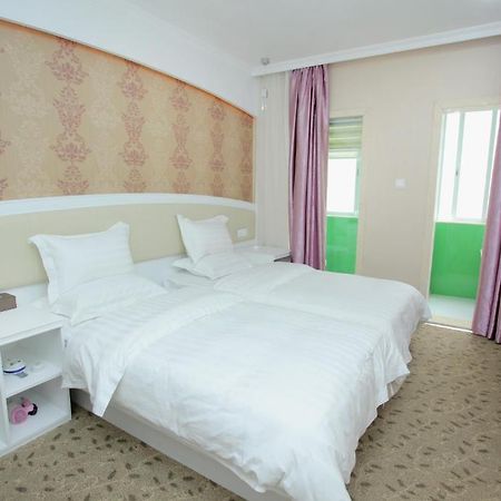 Xinghe Xinfeng Hotel Kanton Zimmer foto