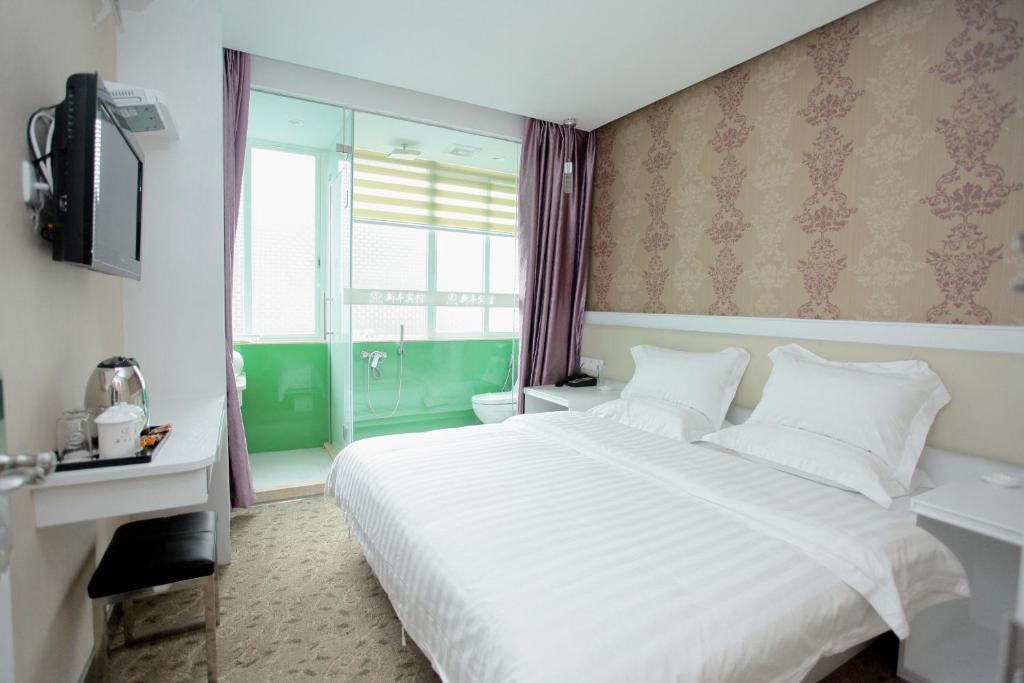 Xinghe Xinfeng Hotel Kanton Zimmer foto