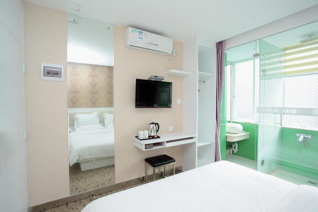 Xinghe Xinfeng Hotel Kanton Zimmer foto